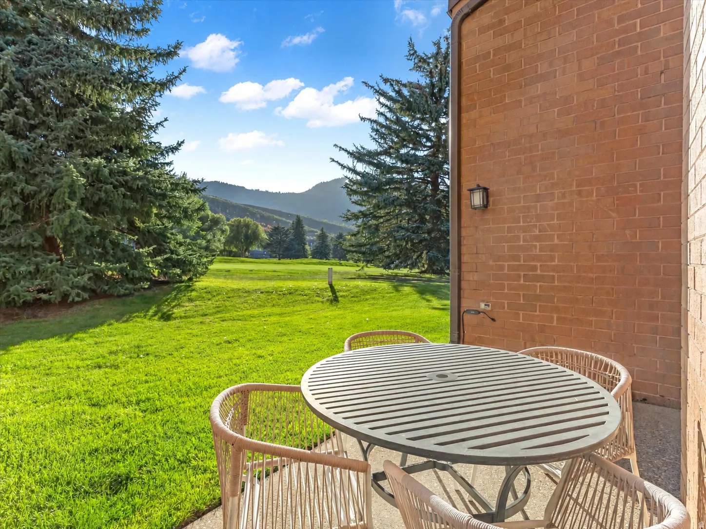 Patio view onto golf course. Table only digitally altered.