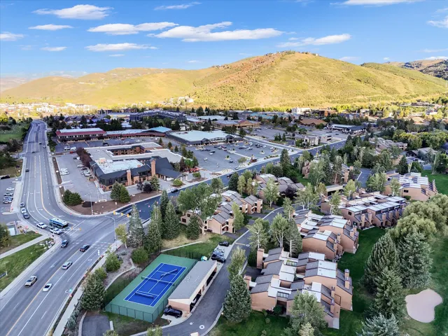Overhead view with tennis court and townhomes