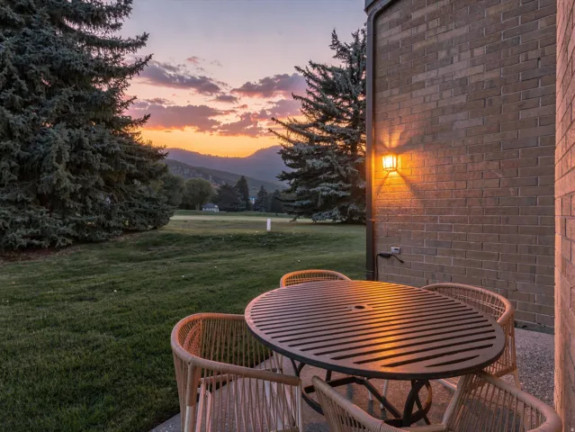 Patio with mountain and golf course view