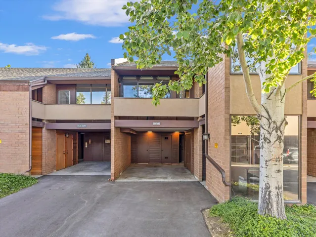 Brick and stucco exterior with integrated carports
