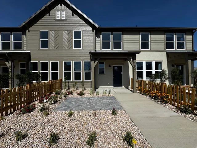 Contemporary exterior with horizontal siding and decorative chevron-patterned panels