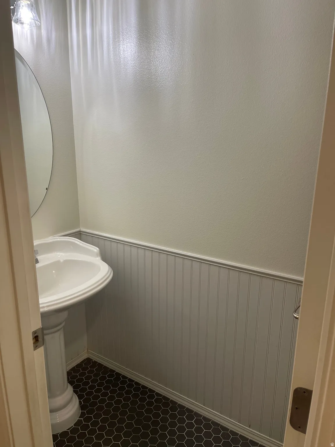 Main Floor Half Bathroom with Pedestal Sink