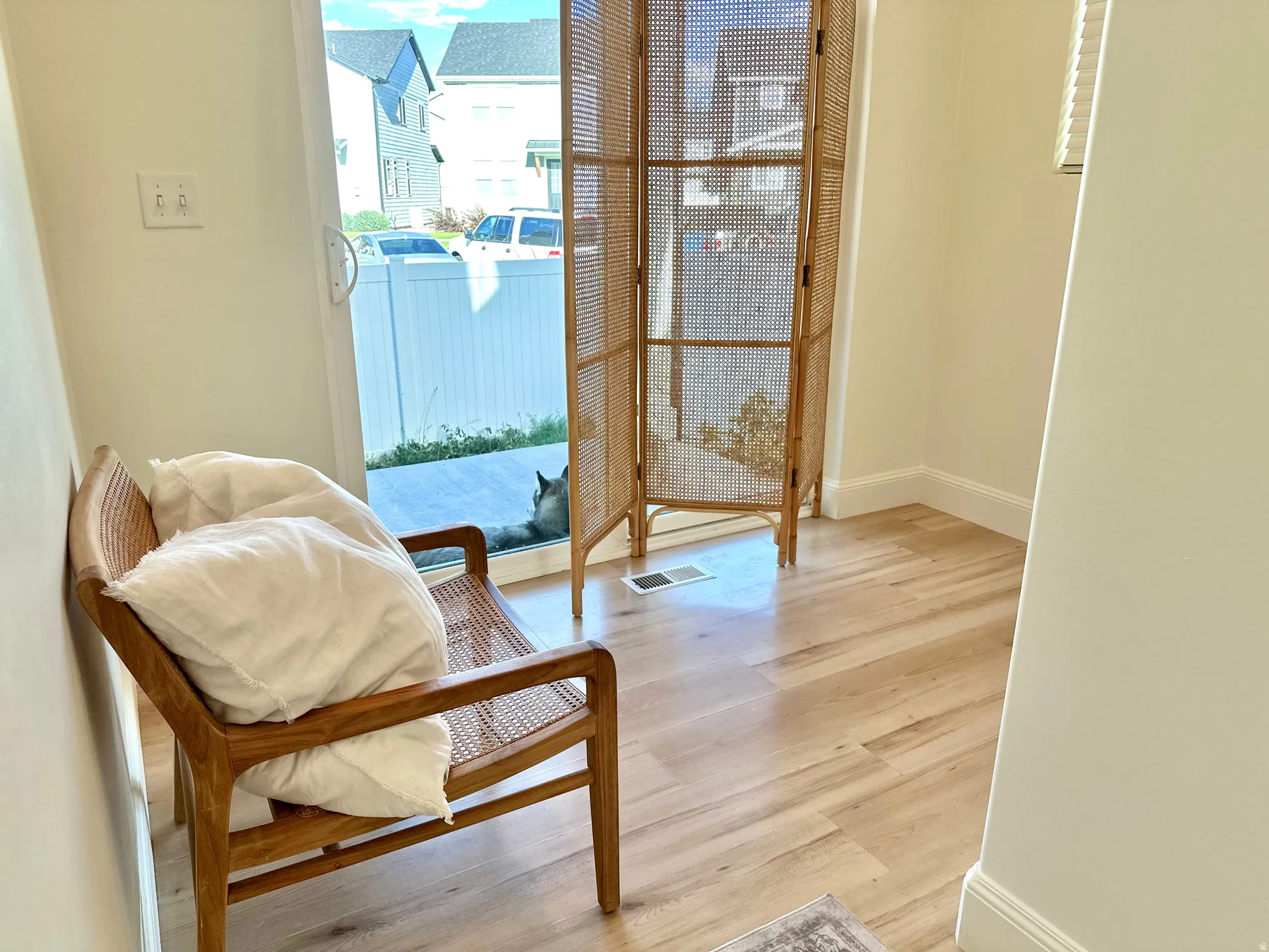 Wood-finish flooring with white wall trim