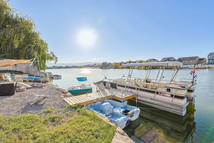 Waterfront property with private wood dock, gravel patio area