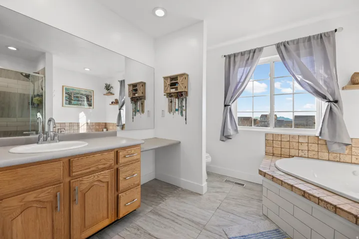 Great primary bathroom. It even has an amazing view of the lake!