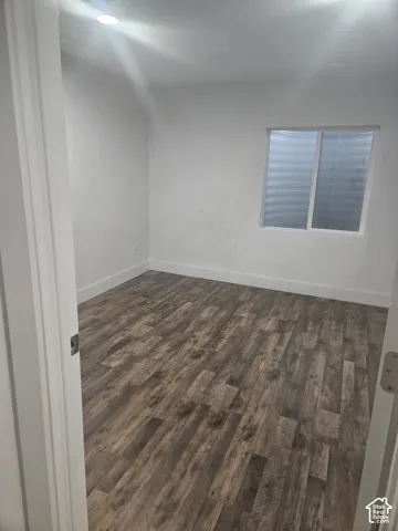 Recessed lighting, wood-finish flooring, and a white framed window