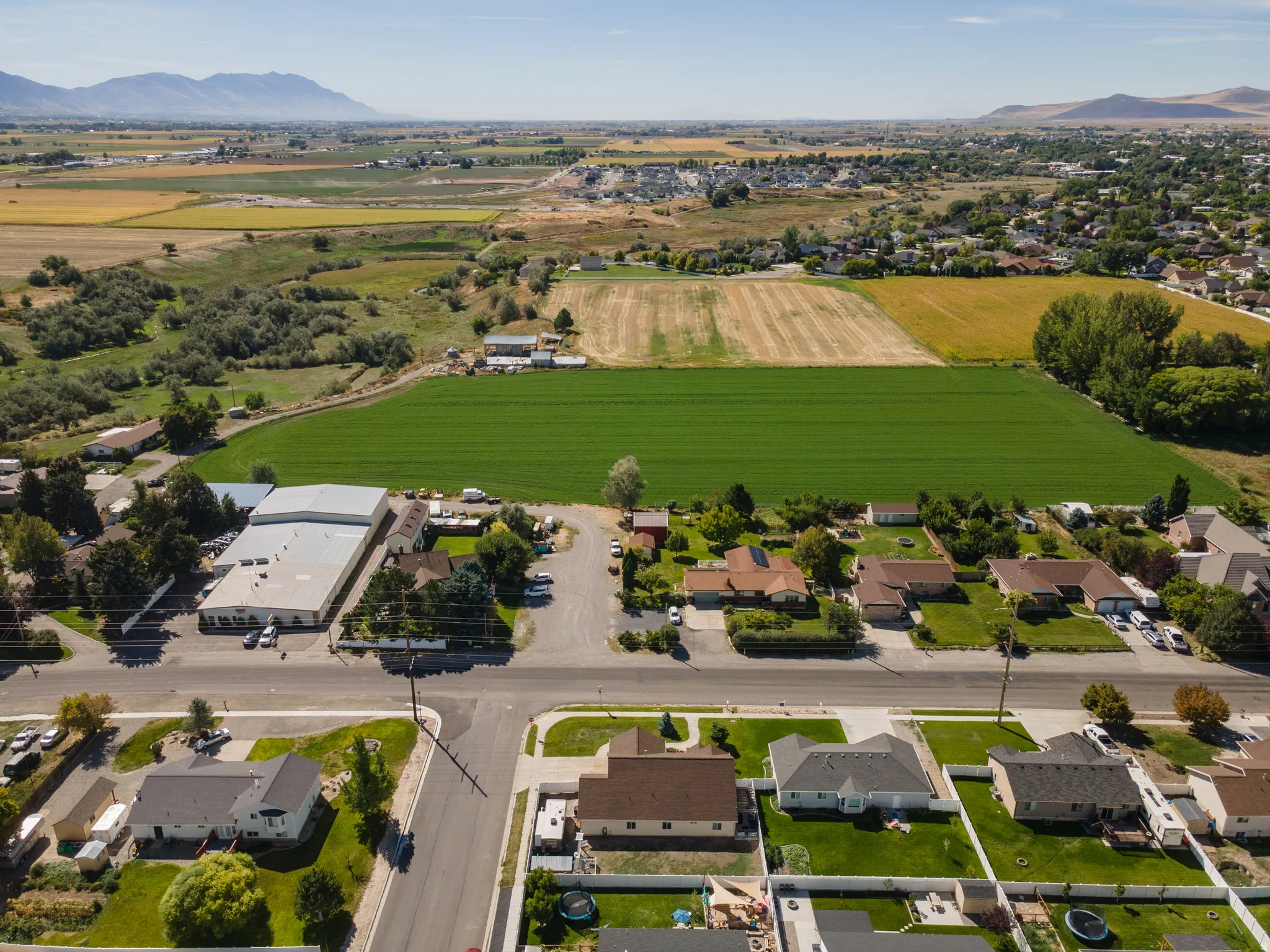 Expansive surrounding rural landscape with distant mountain range
