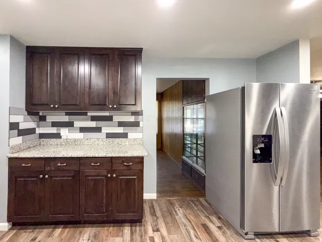 Rich wood-finish cabinetry with silver-tone hardware
