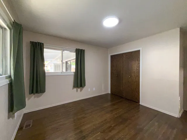 Wood-finish flooring, dual windows, integrated ceiling lighting, and bi-fold closet doors