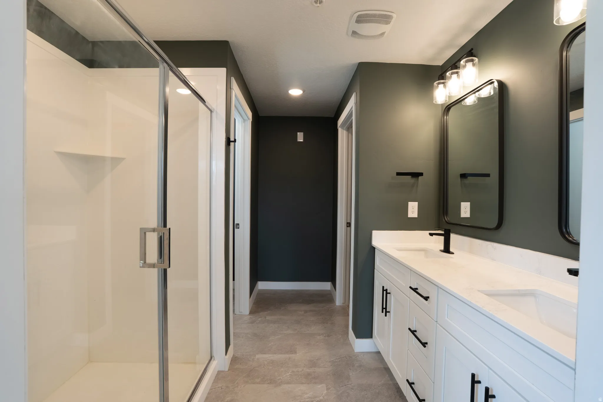 Primary bathroom with separate toilet room and walk-in closet