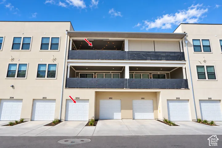 Arrows are what was altered, nothing else. Individual garage parking, dual covered balconies, and contemporary exterior architecture