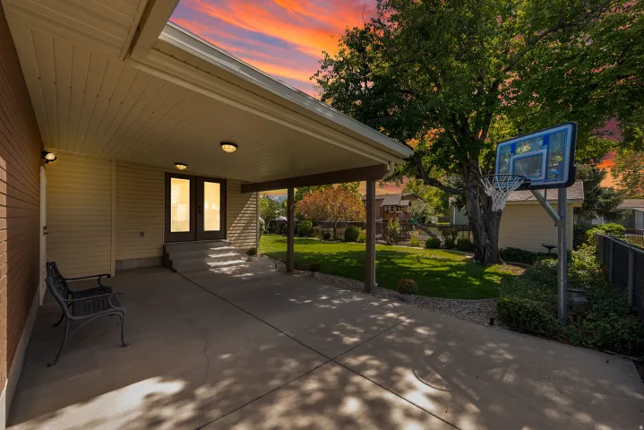 Covered patio with recessed lighting, concrete flooring, and double glass-panel doors
