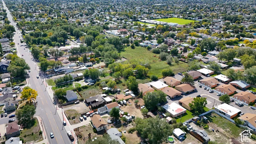 Aerial perspective of a residential area with varied housing styles and mature trees