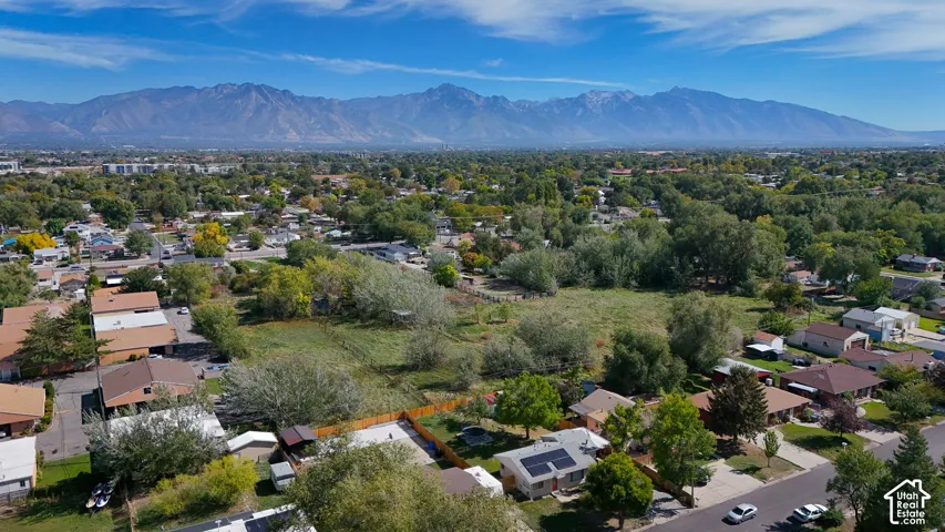 Expansive parcel with mature trees and mountain backdrop