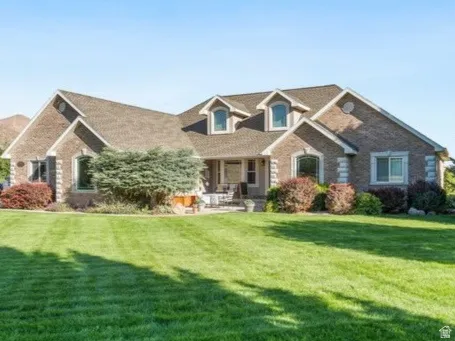 Beautifully cared for front lawn with mature trees and established landscaping
