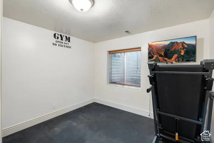 Recessed window with wood-finish trim.  Rubber floor for workouts and equipment.