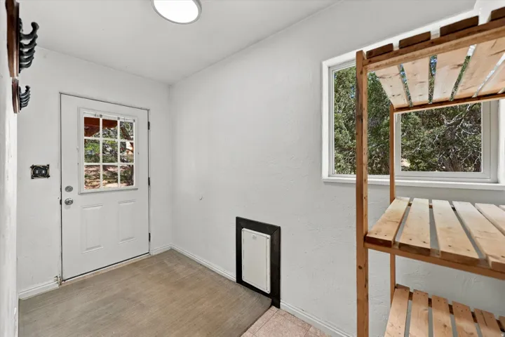 White paneled door with glass window