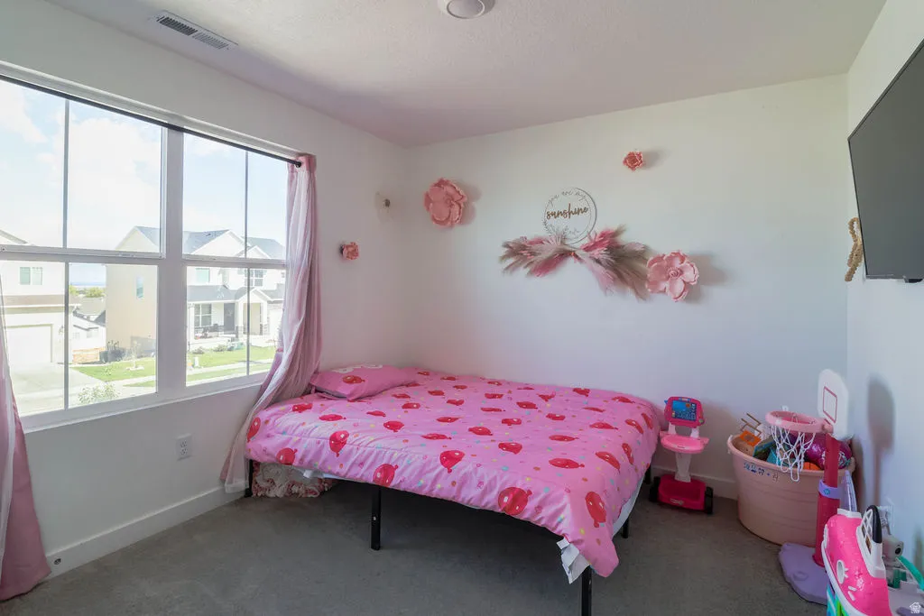White walls with a single window featuring white framing