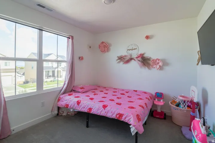 White walls with a single window featuring white framing