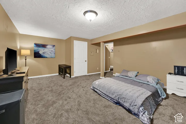 Neutral-toned walls complement the gray carpeting