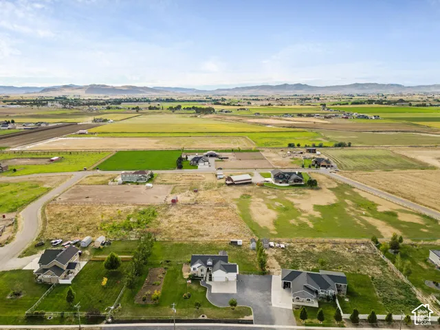 Expansive rural property featuring multiple residential structures and extensive agricultural fields