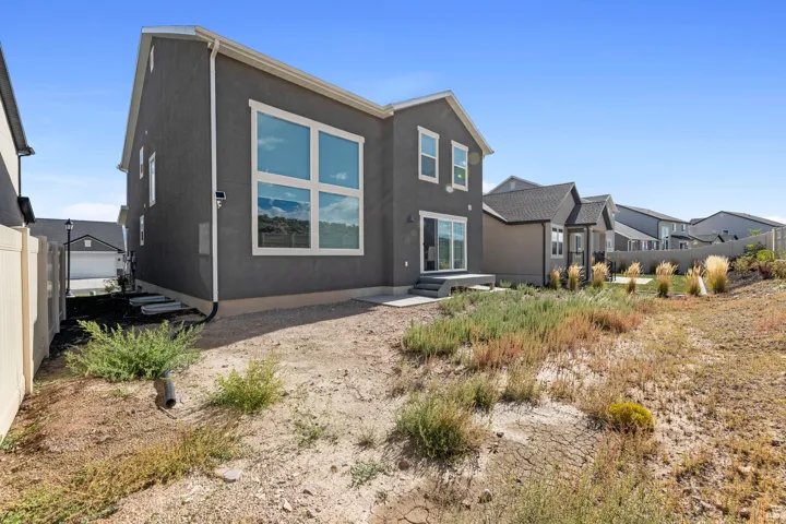 Rear exterior with gray stucco finish