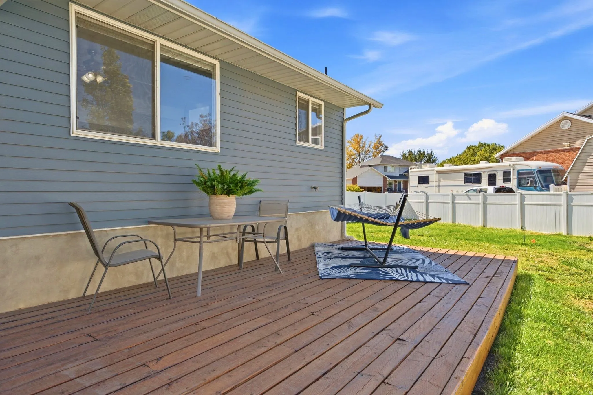 Large patio and spacious deck—perfect for entertaining, relaxing, and enjoying the peaceful backyard.