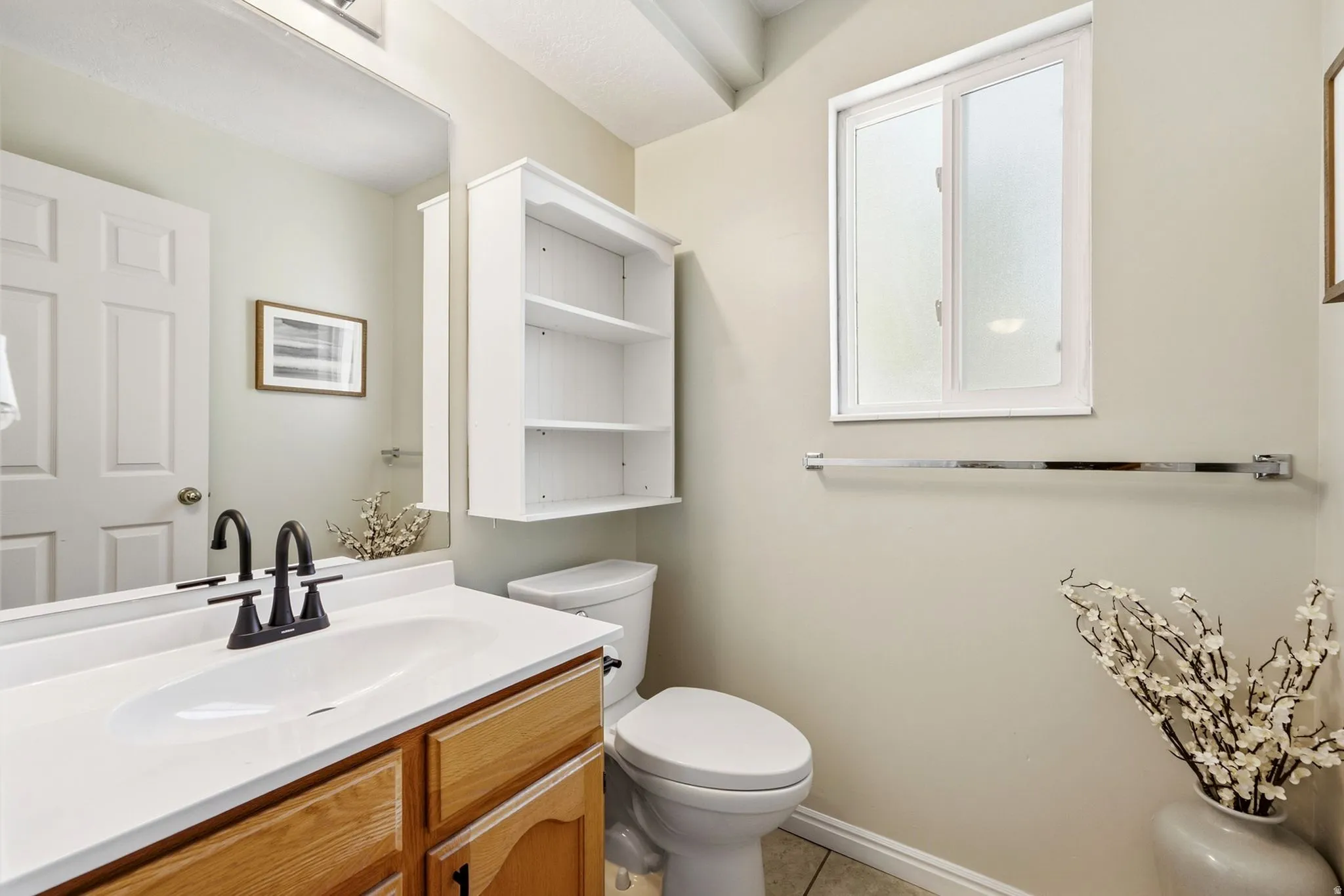 Updated main-floor half bath with stylish finishes and a fresh, modern feel.