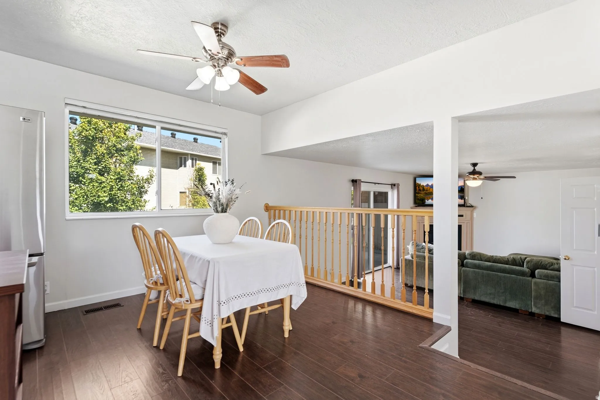 An easy flow from the dining area to the family room, with just three steps creating two connected yet distinct living spaces.