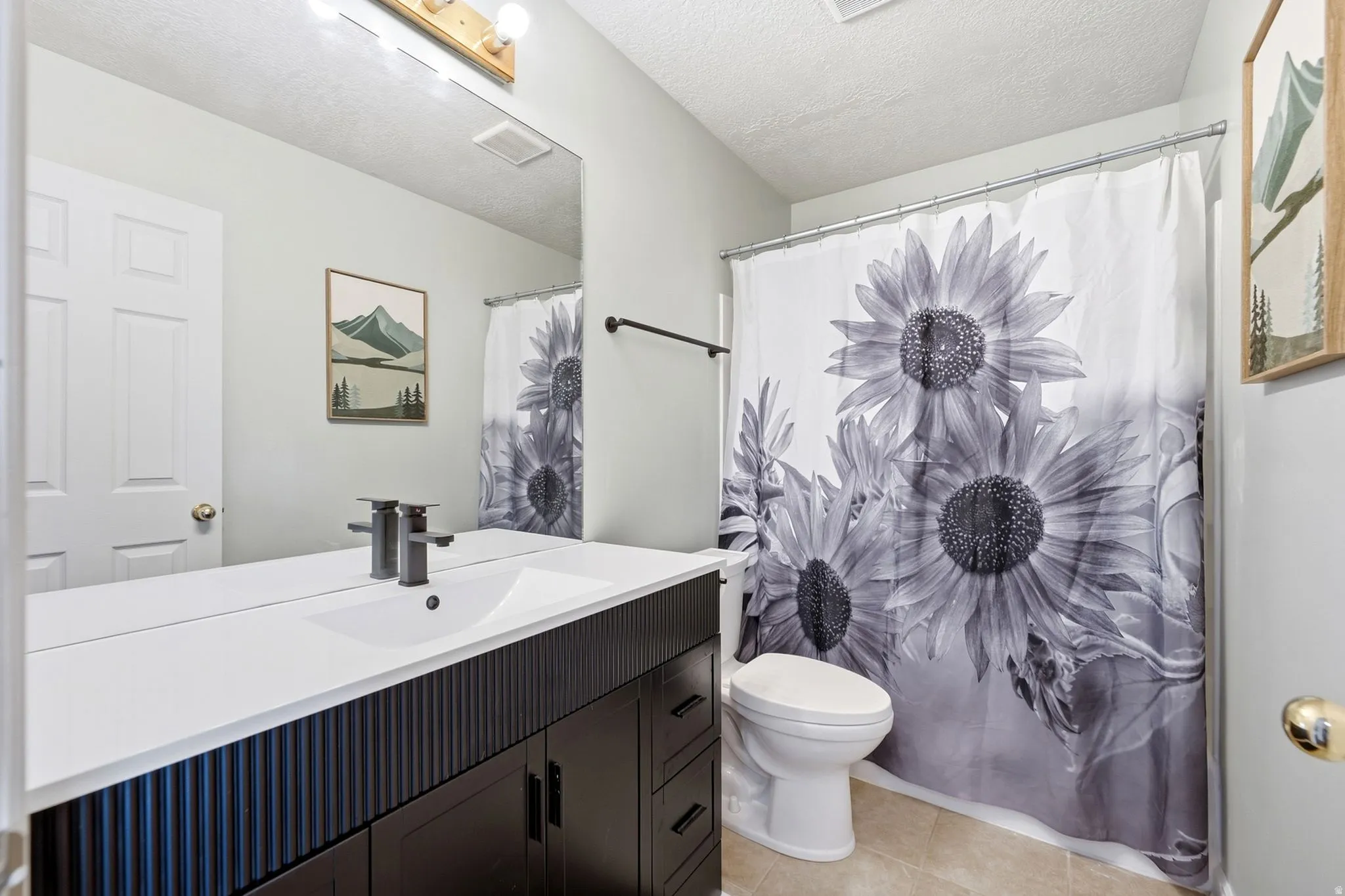 Main bath with spacious vanity with an integrated sink.