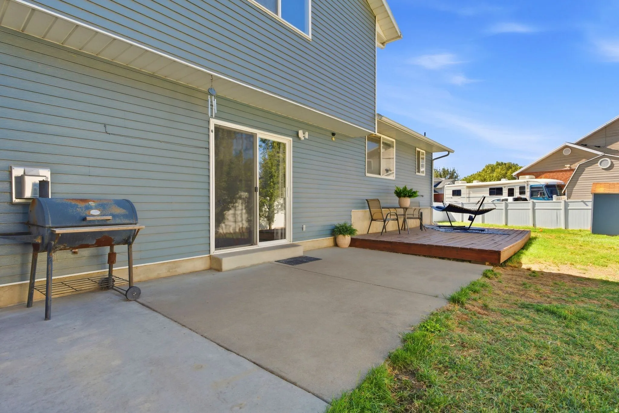 Large patio and spacious deck—perfect for entertaining, relaxing, and enjoying the peaceful backyard.