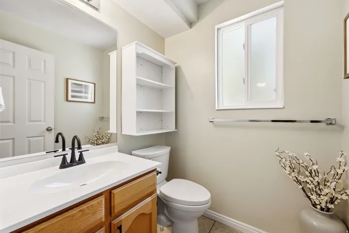 Updated main-floor half bath with stylish finishes and a fresh, modern feel.