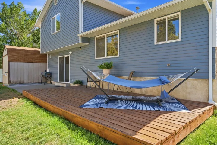 Large patio and spacious deck—perfect for entertaining, relaxing, and enjoying the peaceful backyard.