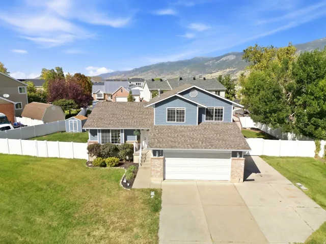 Great curb appeal, a large fully fenced lot, and extra-long RV parking!