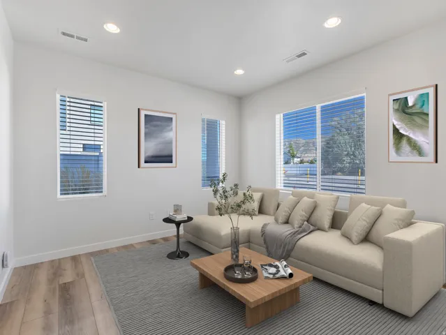 Recessed lighting, multiple windows with blinds, wood-finish flooring, and white walls