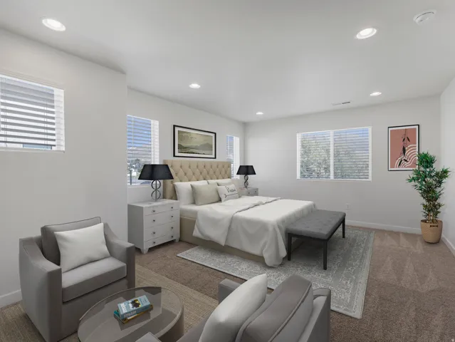 Recessed lighting, multiple windows with blinds, and neutral wall tones