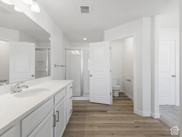 Double vanity with white cabinetry and integrated sink