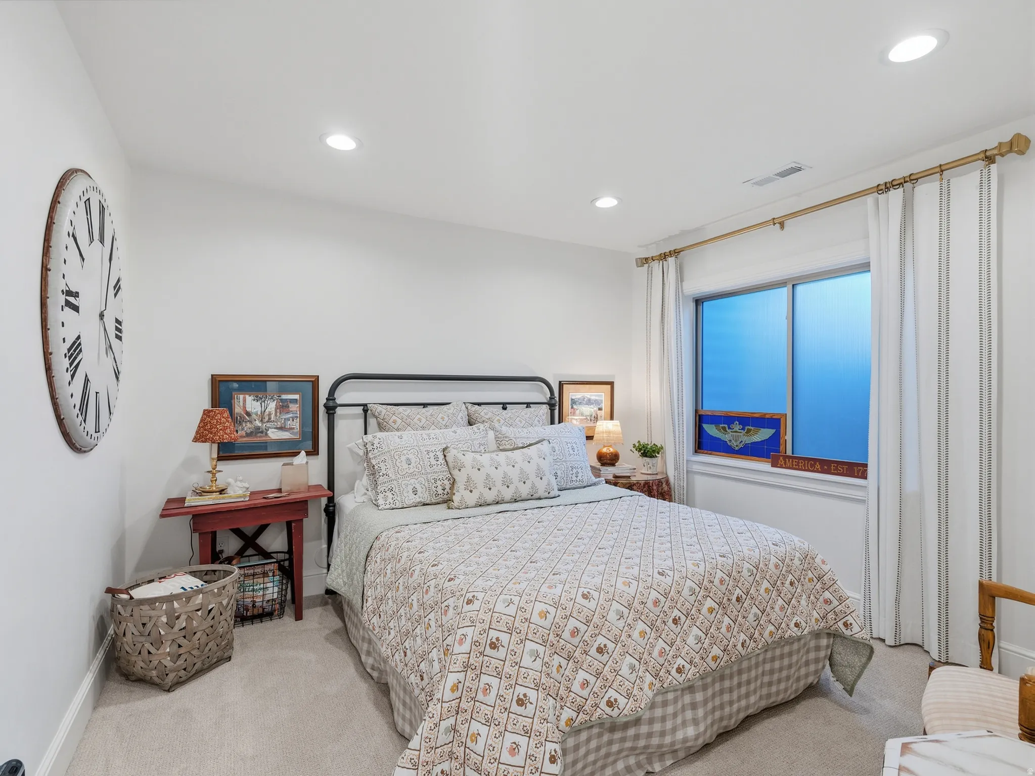 Recessed ceiling lighting, light-toned carpeting, a window with a curtain rod, and painted walls