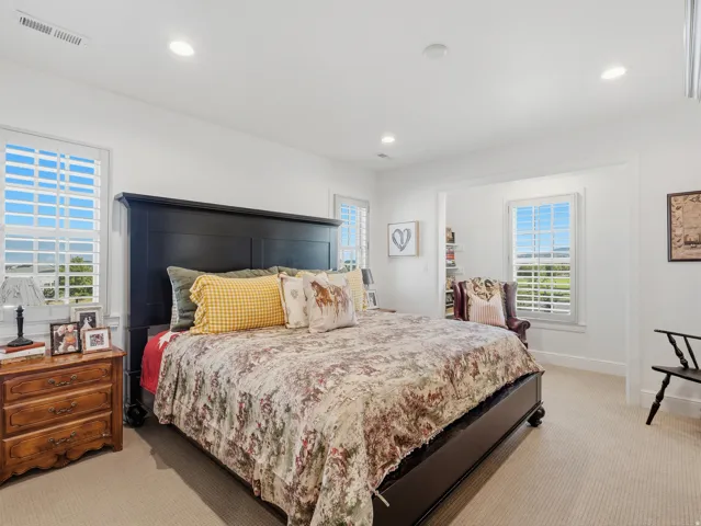 Wall-to-wall carpeting and white walls