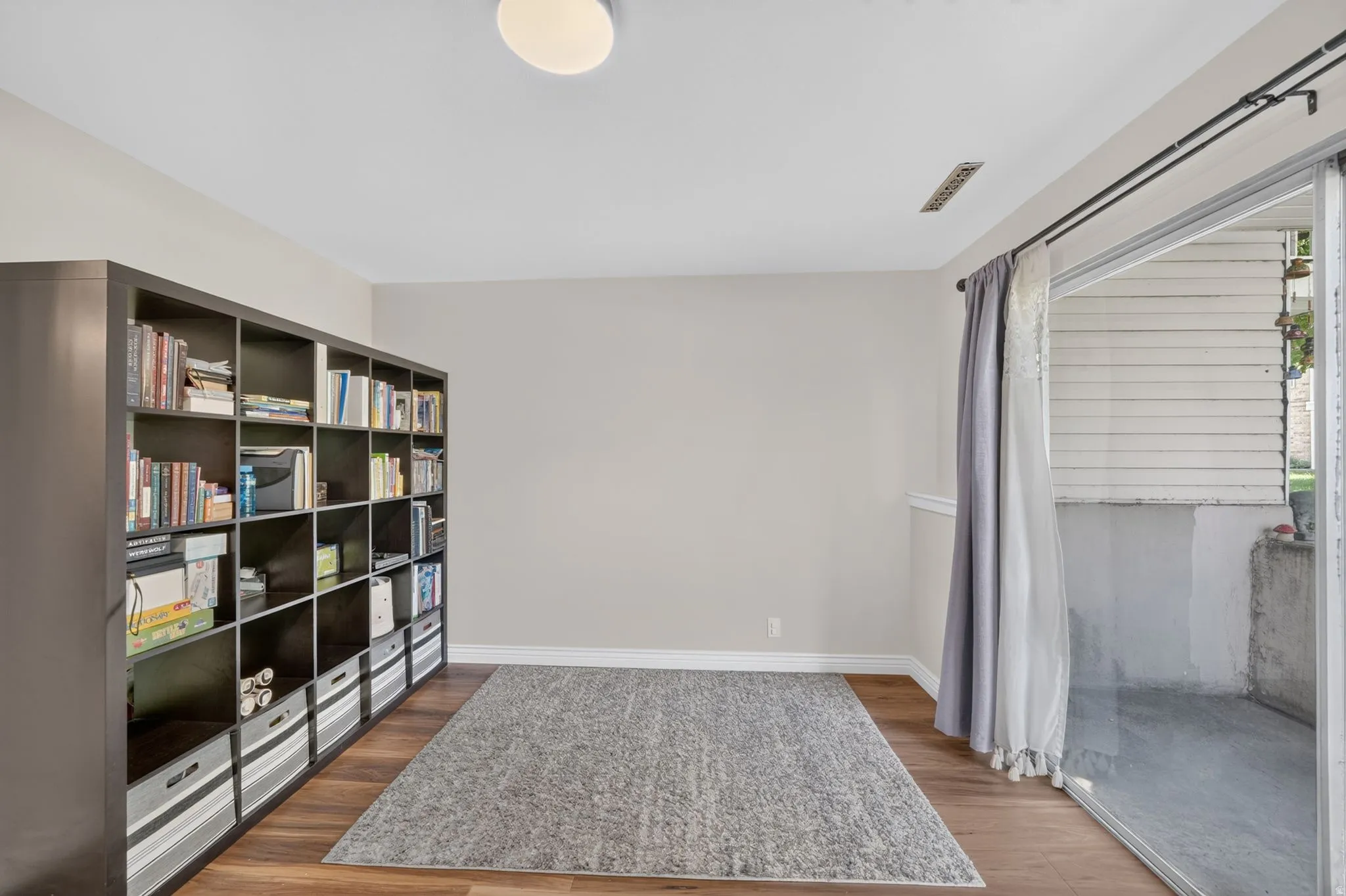 Wood-finish flooring with a neutral wall color