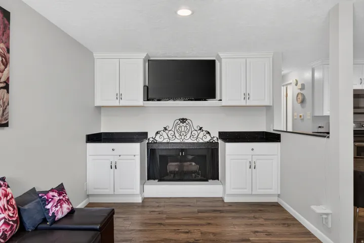 Built in cabinets and gas log fireplace with LVP flooring.