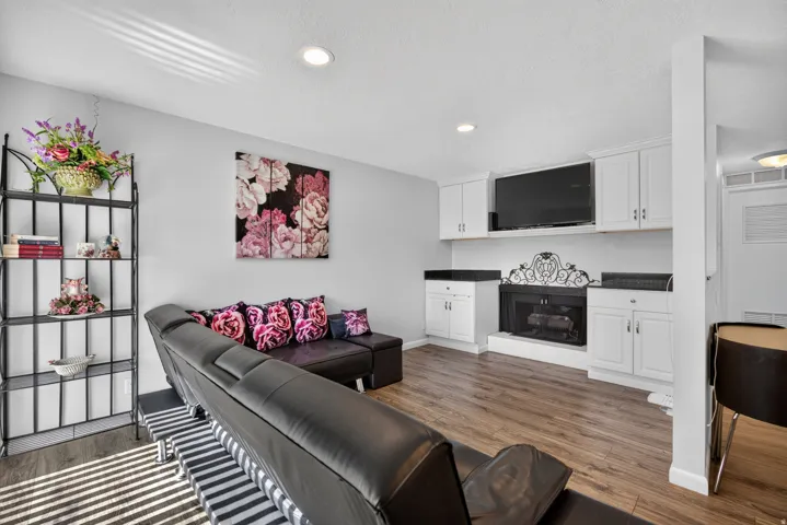 Built in cabinets and gas log fireplace with LVP flooring.