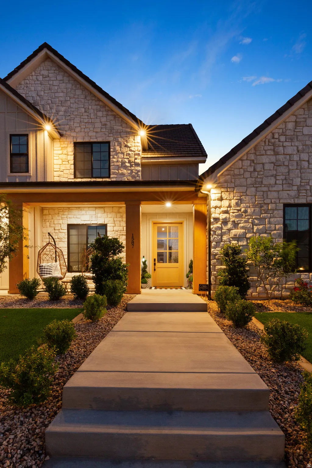 Stone and siding exterior with gabled roof lines