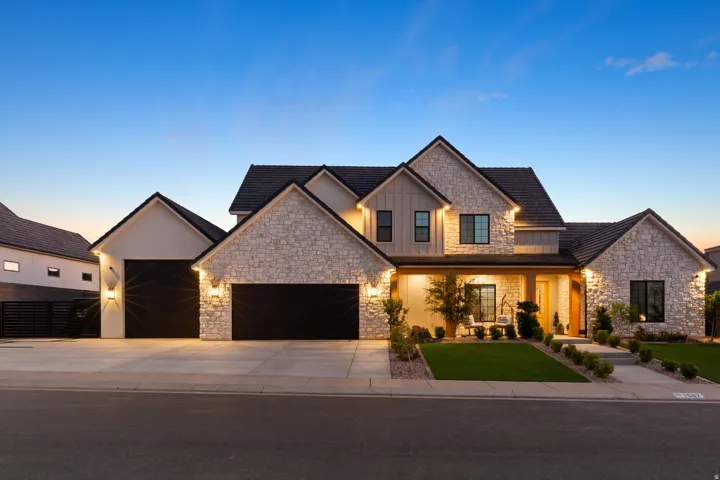Stone and vertical siding exterior with dark framed windows