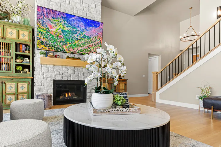 Stone fireplace with a wood mantel