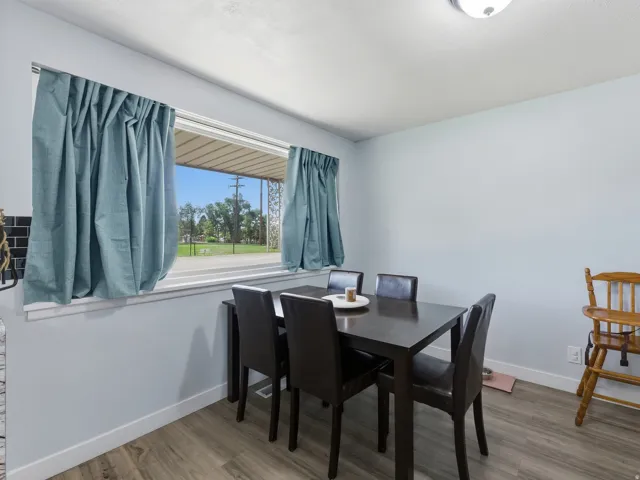 Dining area featuring large window and light gray painted walls