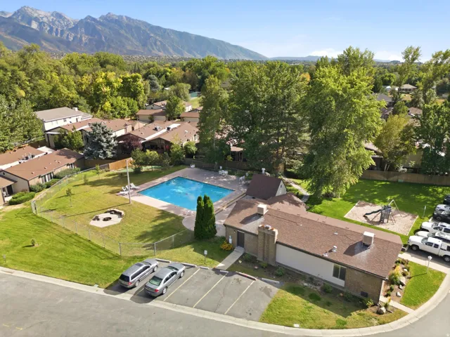 Community amenities include a swimming pool, playground, fire pit area, and dedicated parking