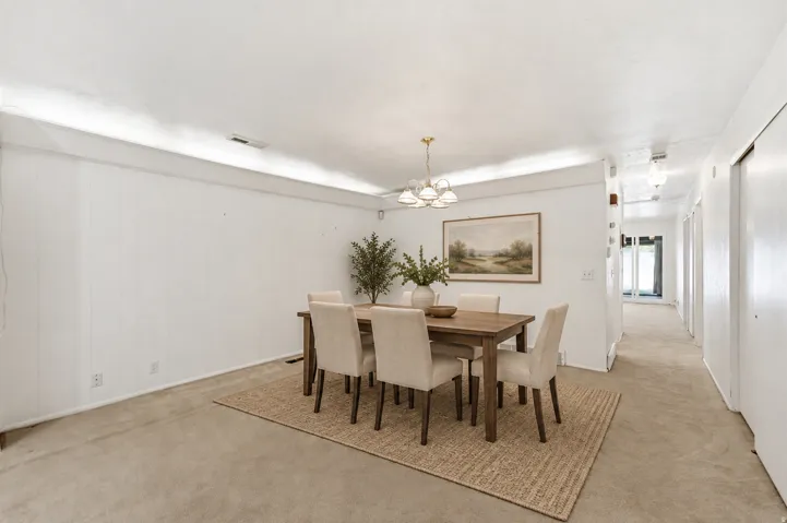 Recessed lighting and ceiling-mounted light fixtures illuminate the space