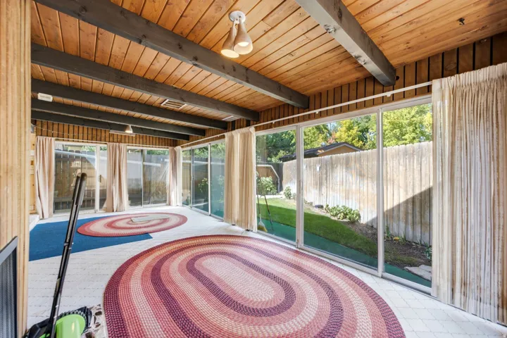 Vaulted wood-paneled ceiling with exposed beams