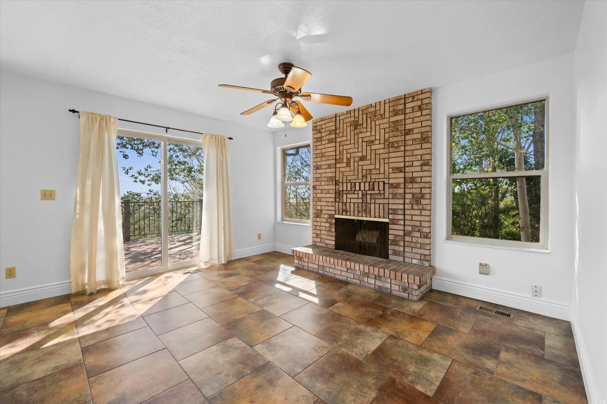 Kitchen w/breakfast nook and semi-formal dining and fireplace.